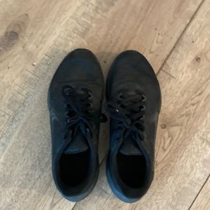 All Black Nike running shoes